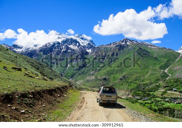 KASHMIR, INDIA - July 14 : Car\
tourist on the way go to snow moutain on July 14,2015 in KASHMIR,\
INDIA