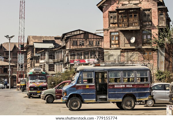 KASHMIR - October 2017: Colorful\
Indian bus on the road of Srinagar city, Jammu and Kashmir,\
India