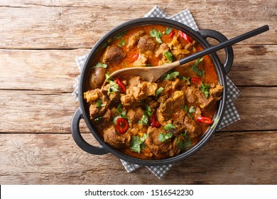 Kashmiri Lamb Rogan Josh With Spices And Gravy Close-up In A Pan On The Table. Horizontal Top View From Above
