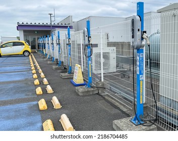 Kasukabe, Saitama, Japan. August 5, 2022. A Row Of NEC Corp. Standard Electric Vehicle Chargers Atop A Rooftop Parking Lot At An AEON Shopping Mall With A Single Car Charging At One Of The Stations. 