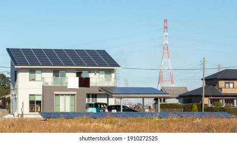 Kasukabe, Saitama, Japan. January 2, 2021. An eco-friendly house with solar panels on its roof and garage roof, as well as in a field out front of the house.   - Shutterstock ID 1910272525