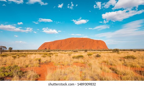 KATA TJUTA NATIONAL PARK, NORTHERN TERRITORY / AUSTRALIA - 13 10 2018: Uluru Ayers Rock Panorama View on a sunny day with a few clouds in the desert of Australias red center and the aboriginal culture