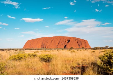 KATA TJUTA NATIONAL PARK, NORTHERN TERRITORY / AUSTRALIA - 13 10 2018: Uluru Ayers Rock Panorama View on a sunny day with a few clouds in the desert of Australias red center and the aboriginal culture