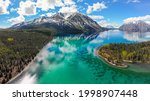 Kathleen Lake, Haines Junction, Yukon Territory, Canada during summertime. Taken by aerial view of the entire blue, green, turquoise natural view. Boreal, wilderness, spruce forest surrounding.