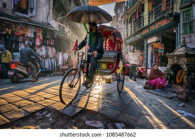 Kathmandu / Nepal - 12.20.2103: A Rickshaw Is Passing In A Small Street