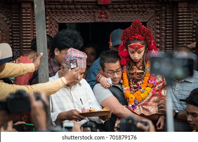 Kathmandu, Nepal - April 16 2016: Nepalese people holding royal Kumari in the parade of Seto Machindranath Jatra festival in Kathmandu the capital cities of Nepal.