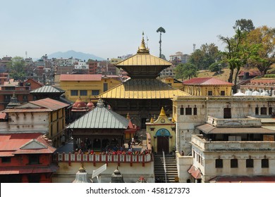 KATHMANDU, NEPAL - APRIL 20, 2016: tourist and devoted people visiting sacred Hindu temple dedicated to Pashupatinath in Kathmandu, Nepal.
