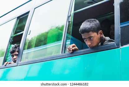 KATHMANDU, NEPAL - APRIL 2015: Young Sad Boy Looking Out Of The Bus Window.