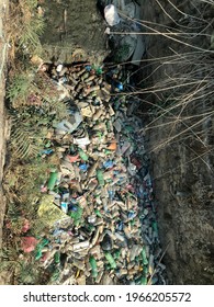 Kathmandu, Nepal, April 26, 2021: A Plastic Pile On The Green Grass, A Natural Environment Issue, Nature Contamination Is Not Plastic Breaking Down