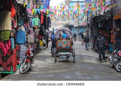 Kathmandu, Nepal - August, 2020: The People Of Nepal. Colorful Streets In The Thamel Full With Rickshaws And Local Stores.