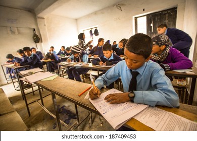 KATHMANDU, NEPAL - DEC 19, 2013: Unknown Children In The Lesson At Public School. Adult Literacy (age 15+) 60.3% (female: 46.3%, Male: 73%) In A 2010 Population Census.