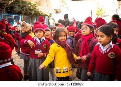 KATHMANDU, NEPAL - DEC 22: Unknown pupils during lesson in primary school, Dec 22, 2013 in Kathmandu, Nepal. Only only 25% of girls attend schools and half of the children can reach the 5 grade. - Shutterstock ID 171128897
