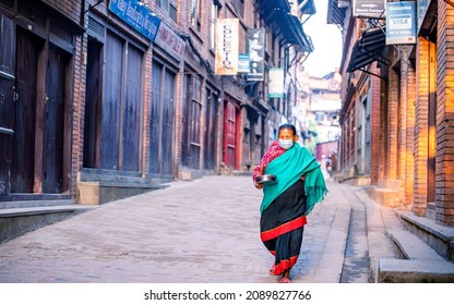 KATHMANDU, NEPAL - December 11, 2021: People Wearing Mask And Selling Vegetables On Street Market, Daily Stuggle Life Of Street Vendor During Covid Pandemic At Kathmandu.
