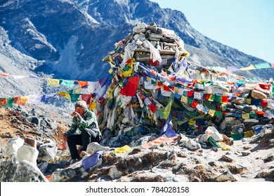 Kathmandu, Nepal - December 22, 2012: Sherpa Is Taking A Break On The Way To Mount Everest Base Camp.