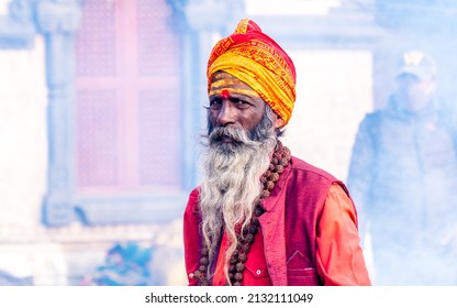 KATHMANDU, NEPAL - February 28, 2022:  Hindu holy man sadhhu stay around the temple during  Maha-Shivaratri at the Pashupatinath temple in Kathmandu.