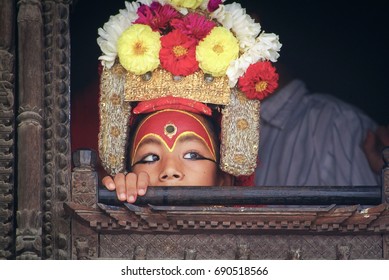 KATHMANDU, NEPAL - SEPTEMBER 17, 2005 : Kumari Devi or Living Goddess On the Window of Kumari Ghar Palace, is Believed to be Incarnation of Taleju (Mother-Goddess) chief Protective Deity of Nepal.