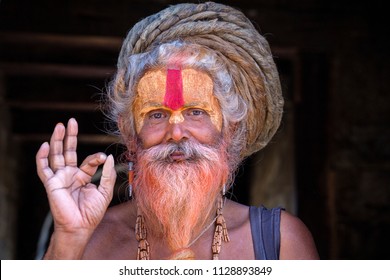 KATHMANDU, NEPAL - SEPTEMBER 25, 2016 : Portrait Sadhu at Pashupatinath Temple in Nepal. Sadhu is a holy man, who have chosen to live an ascetic life and focus on the spiritual practice of Hinduism.