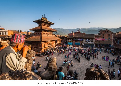 KATHMANDU, NEPAL-APRIL 14: Crowding of local Nepalese people visit the famous square of Bhaktapur on April 14, 2010 in Kathmandu, Nepal. Bhaktapur is the third largest city in Kathmandu valley.