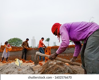 Katni, INDIA - December 2019: Raw Materials Mixing By Spade Holded Hand By Indian Labour At Construction Site 