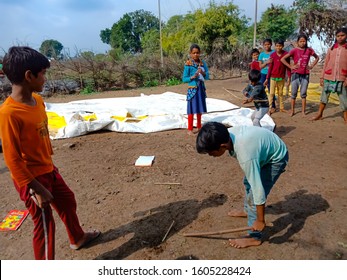 Katni, INDIA - January 1, 2020: Indian Village Poor Kids Playing Gilli Danda Local Indian Traditional Game At Outside Area 