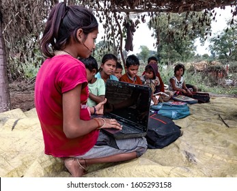 Katni, INDIA - January 1, 2020: Indian Village Girl Reboot Laptop Computer At Open Area Class 