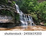 Katoomba Falls in the Blue Mountains, New South Wales, Australia. Waterfall in the lush green temperate rainforest.