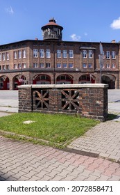 Katowice, Nikiszowiec, Poland - July 29, 2021 : Historic Housing Estate For Coal Miners From The Beginning Of The 20th Century, Liberation Square With Water Tower. Built As A District Of Katowice 