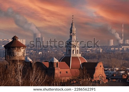 Katowice, Nikiszowiec, Poland, Polska.Church of St. Anna,view of the Jaworzno power plant