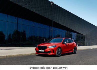 Katowice / Poland- 09.16.2020: BMW M135i in front of the building of the International Congress Center. Model F40, produced from 2019. 306 HP engine, acceleration 0-100 km / h - 4.8 s