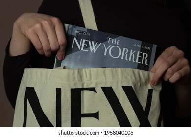 Katowice, Poland – April 17, 2021: A Woman Is Taking Out The New Yorker Magazine From A Tote Bag.