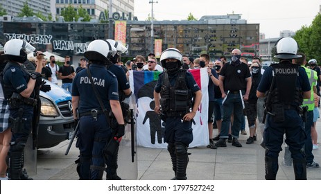 KATOWICE/ Poland - August 10, 2020: The Struggle For LGBT Equality. Pride Meets Prejudice In Poland. Group Of Traditionalists Fighting Against LGBT.  Demonstration During Coronavirus Pandemic.