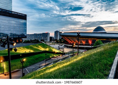 Katowice, Poland, June 2021: Spodek sports arena illuminated by evening lights, famous landmark of Katowice city and green roof of International Congress Centre