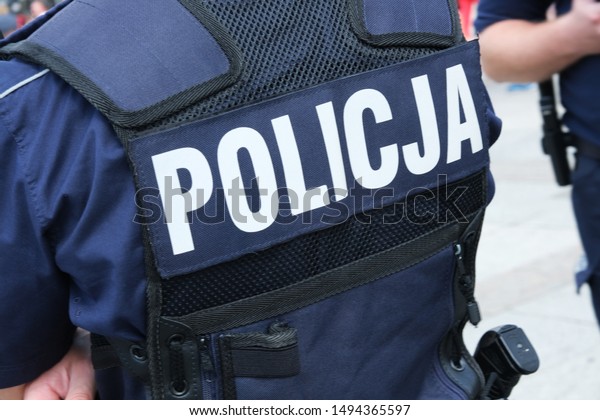 Katowice, Poland-august/15/2019 The
policeman on the street on duty. Close up of police
logo.
