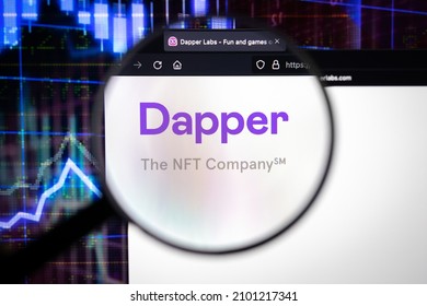 KAUFBEUREN, GERMANY - November 27, 2021. Dapper company logo on a website with blurry stock market developments in the background, seen on a computer screen through a magnifying glass.