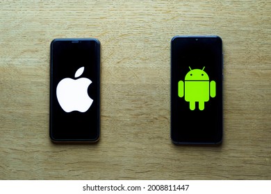Kaunas, Lithuania - 2021 July 15: Apple and android smartphones. Iphone IOS versus Android operating system