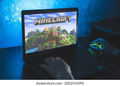 Kaunas, Lithuania - 2021 October 4: Minecraft is a sandbox video game. Video computer game. Man play video game on laptop