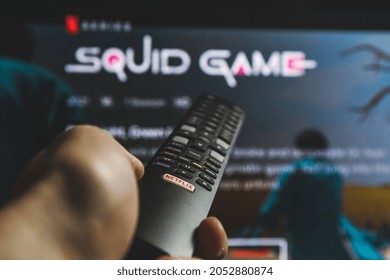 Kaunas, Lithuania - 2021 October 4: Watching Squid game show on TV. Squid game is a South Korean survival drama television series streaming on Netflix
