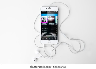 KAUNAS, LITHUANIA - APRIL 20, 2017: Playing Music On IPhone 6S. Spotify Is A Music, Podcast, And Video Streaming Service, Officially Launched On 7 October 2008.