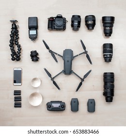 KAUNAS, LITHUANIA - APRIL 24, 2017: Photography Equipment On Wooden Background: DSLR Camera Nikon D810, Drone DJI Mavic Pro, IPhone 6S Lenses And Other Stuff