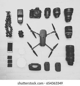 KAUNAS, LITHUANIA - APRIL 24, 2017: Photography Equipment On Wooden Background: DSLR Camera Nikon D810, Drone DJI Mavic Pro, IPhone 6S Lenses And Other Stuff
