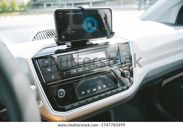 KAUNAS, LITHUANIA - APRIL 30, 2020: New\
Volkswagen e-Up! all-electric car. Closeup view of maps+more dock\
for vehicle info, hands-free calls and\
navigation