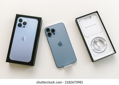 KAUNAS, LITHUANIA - JULY 20, 2022: Unboxing a new flagship Apple iPhone 13 Pro Max smartphone with triple-lens camera