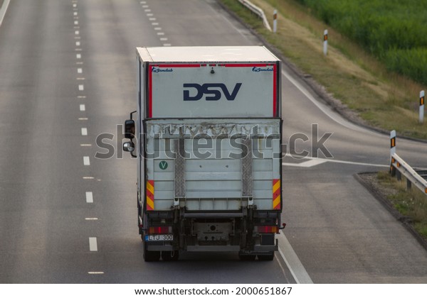 \
KAUNAS, LITHUANIA – JUNE 30, 2021: DSV\
cargo truck on the highway. DSV is global transport and logistics -\
road, air, sea, rail freight and\
warehousing.\
