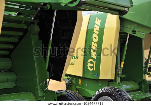 Kaunas,\
Lithuania - March 23: Krone tractor and logo on March 23, 2018 in\
Kaunas, Lithuania. Maschinenfabrik Bernard Krone GmbH is one of\
Europe\'s foremost producers of forage\
harvesters.