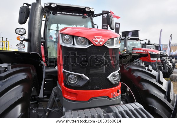 Kaunas, Lithuania - March 23: Massey Ferguson\
tractor and logo on March 23, 2018 in Kaunas, Lithuania. Massey\
Ferguson Limited is an American-owned major manufacturer of the\
agricultural equipment.
