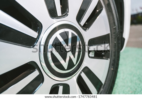 KAUNAS, LITHUANIA - MAY 28, 2020: New Volkswagen\
e-Up! all-electric car with 36.8kWh capacity battery. Closeup view\
of VW logo.