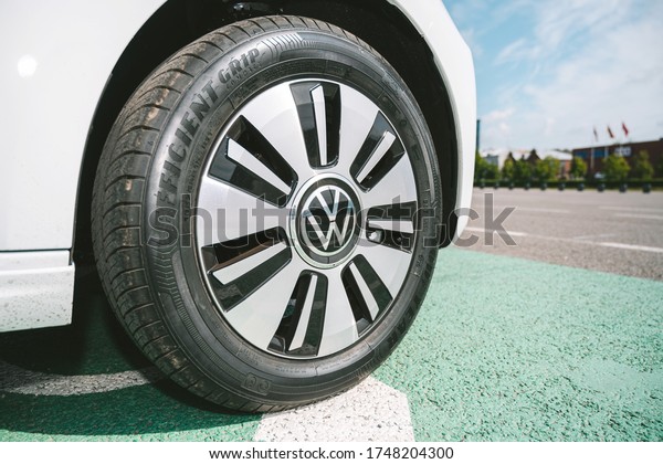 KAUNAS, LITHUANIA - MAY 28, 2020: New Volkswagen\
e-Up! all-electric car with 36.8kWh capacity battery. Closeup view\
of VW logo.
