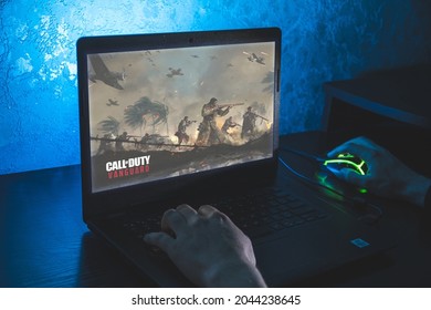 Kaunas, Lithuania - September 17 2021: Call of Duty: Vanguard is first-person shooter video game. Man playing video game on laptop