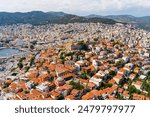 Kavala, Greece. Kavala Fortress - Ruins of a 15th century castle with a round tower. Port. Aerial view