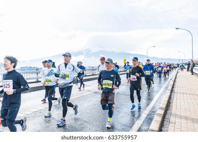 Kawaguchiko, JAPAN - Nov 27, 2016: Kawaguchiko Marathon 2016. People Running On The Bridge Crossing Kawaguchiko Lake.